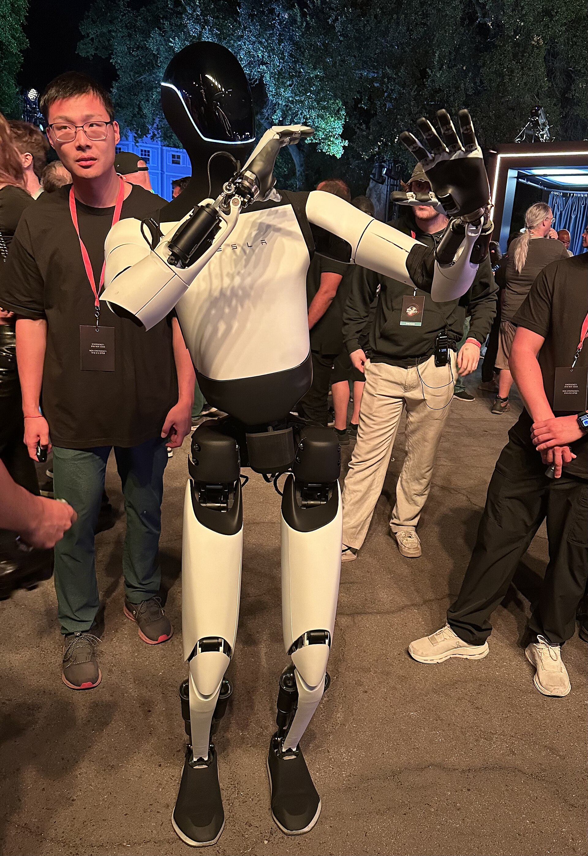 Tesla Optimus Gen 2 among people at an event